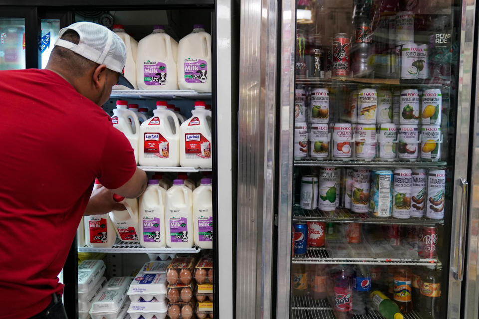 A person arranges groceries in El Progreso Market in the Mount Pleasant neighborhood of Washington, D.C.