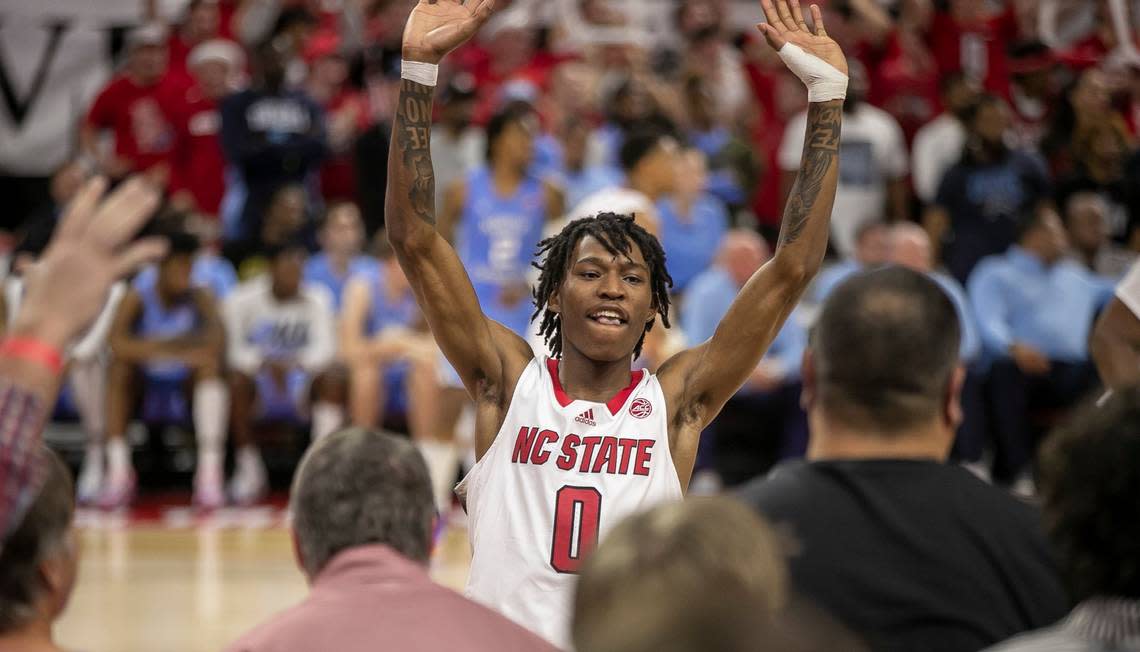 N.C. State’s Terquavion Smith (0) acknowledges the Wolfpack students section as the open a ten point lead over North Carolina the second half on Sunday, February 19, 2023 at PNC Arena in Raleigh, N.C.