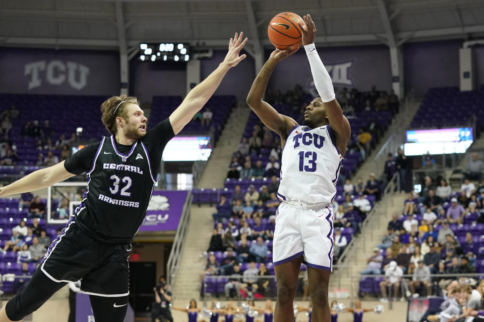 TCU guard Shahada Wells (13) shoots against Central Arkansas center Churchill Bounds (32) during the first half of an NCAA college basketball game in Fort Worth, Texas, Wednesday, Dec. 28, 2022. (AP Photo/LM Otero)
