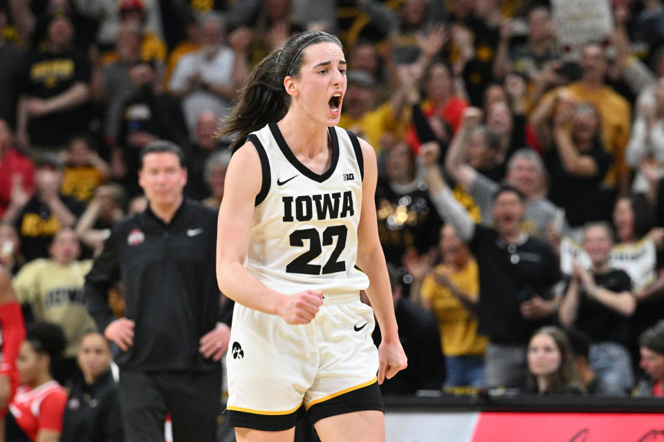 Mar 3, 2024; Iowa City, Iowa, USA; Iowa Hawkeyes guard Caitlin Clark (22) reacts after breaking the NCAA basketball all-time scoring record during the second quarter against the Ohio State Buckeyes. Jeffrey Becker-USA TODAY Sports