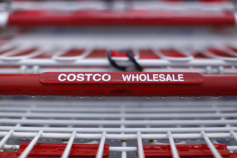 Costco shopping carts await customers outside a Costco Warehouse in Carlsbad, California February 28, 2012. Costco will report earnings this week. REUTERS/ Mike Blake (UNITED STATES - Tags: BUSINESS)