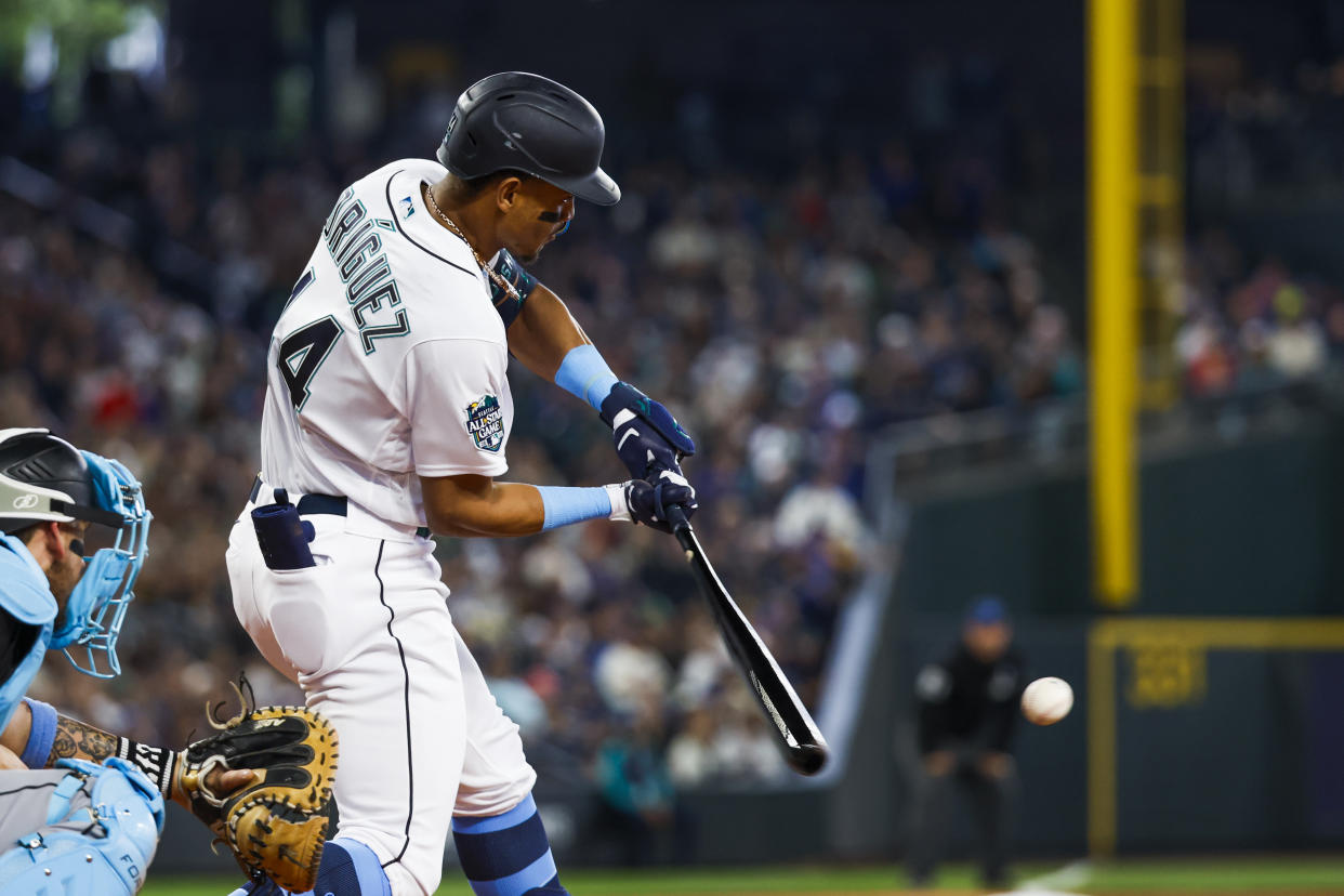 Jun 18, 2023; Seattle, Washington, USA; Seattle Mariners center fielder Julio Rodriguez (44) hits a two-run double against the Chicago White Sox during the third inning at T-Mobile Park. Mandatory Credit: Joe Nicholson-USA TODAY Sports