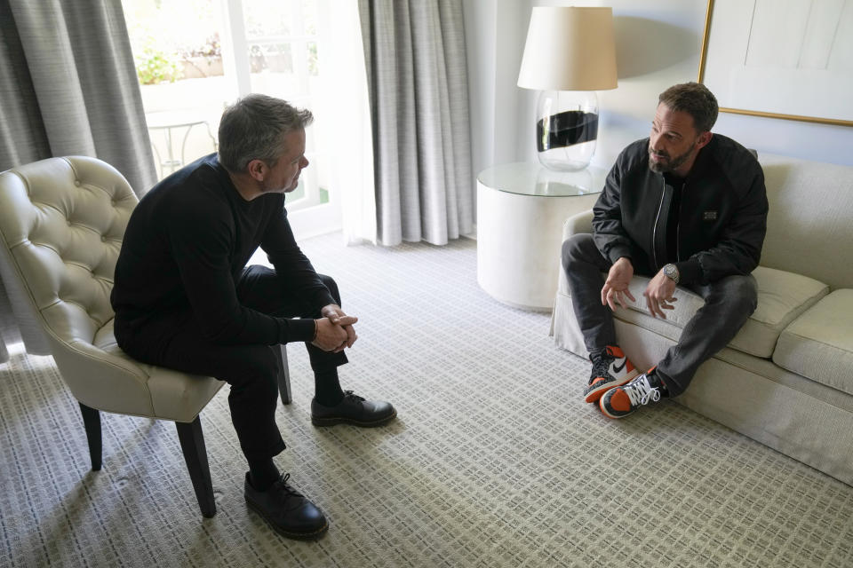 Ben Affleck, right, and Matt Damon chat during a portrait to promote the film "Air" on Monday, March 27, 2023, at the Four Seasons Hotel in Los Angeles. (AP Photo/Ashley Landis)