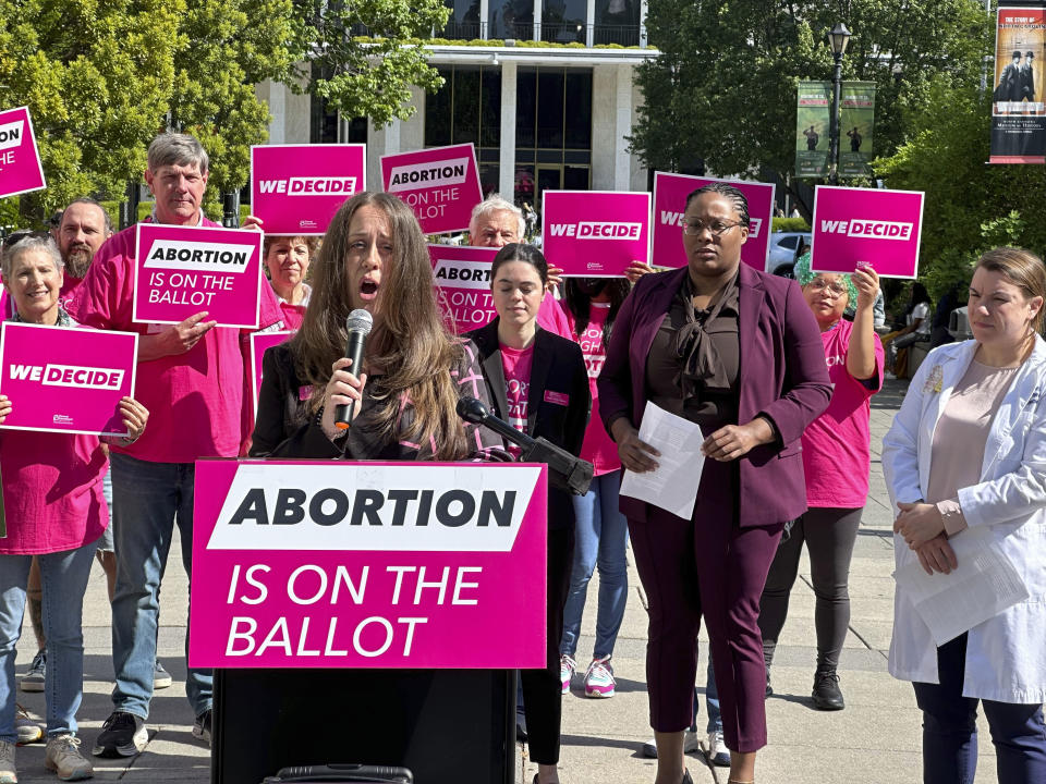 Planned Parenthood Votes South Atlantic spokesperson, Emily Thompson, announces a $10 million investment into a state voter engagement campaign at a press conference in Bicentennial Plaza in Raleigh, N.C., on Thursday, April 25, 2024. The campaign will focus on canvassing, mailers, digital ads and phone banking to block a GOP legislative supermajority and Republican governor in the 2024 election. (AP Photo/Makiya Seminera)