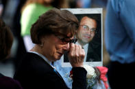 <p>A woman wipes away tears as she holds a photograph of Alex Ciccone, a victim of the Sept. 11, 2001, attacks on the World Trade Center, at the National 9/11 Memorial and Museum during ceremonies marking the 16th anniversary of the attacks in New York, Sept. 11, 2017. (Photo: Brendan McDermid/Reuters) </p>