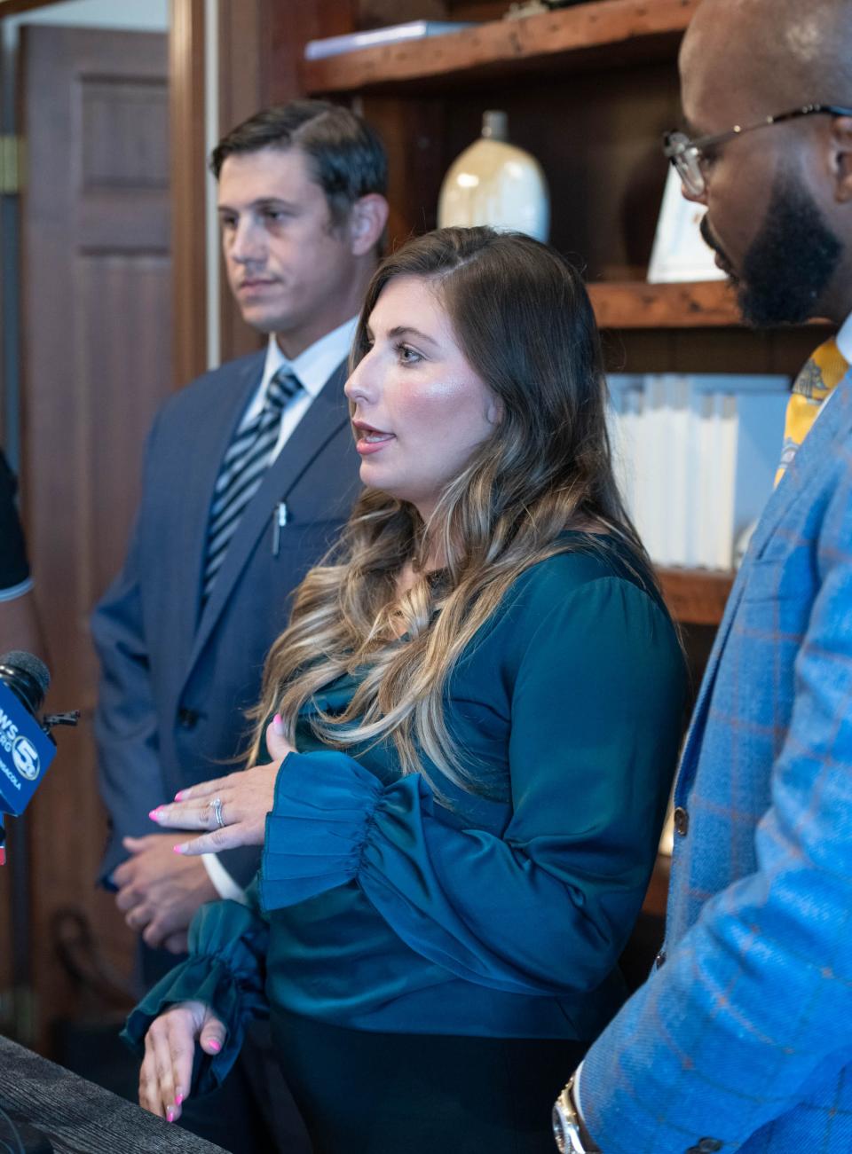 Jordan Gray, center, talks during a press conference at the Watson Firm in Pensacola on June 14, 2023.  Gray and her husband Brandon Gray tested positive for methamphetamines after eating at Nikko Japanese Steak House and Sushi Bar in Pace on Friday, June 9, 2023.