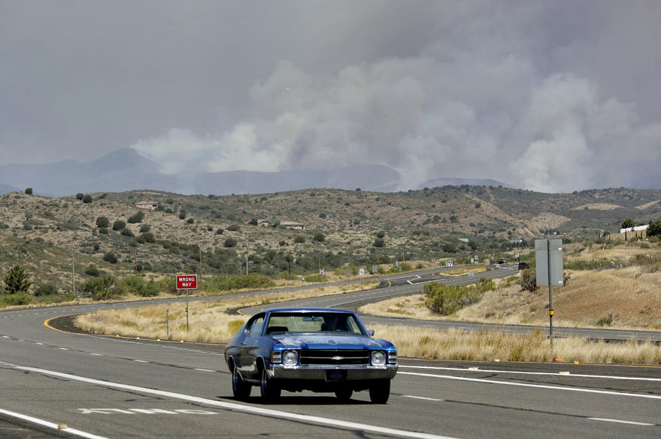 <p>A fire burns near Mayer, Ariz, Wednesday, June 28, 2017, as seen from Spring Valley, Ariz. The fire has burned over 28 square miles (73 square kilometers). More than 500 firefighters are battling the blaze that’s near the small town where 19 members of an elite firefighting unit were killed while battling a blaze four years ago. (AP Photo/Matt York) </p>