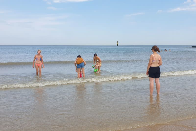 People enjoy a hot summer day on a beach during the coronavirus disease (COVID-19) outbreak, in Knokke-Heist