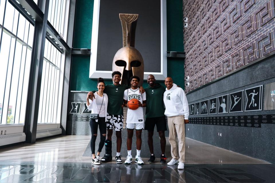 New MSU basketball commit Jase Richardson, center, poses with his mother, Jackie Paul, younger brother and father, Jason Richardson, who starred at Michigan State from 1999-2001. Also pictured, MSU assistant coach Mark Montgomery.