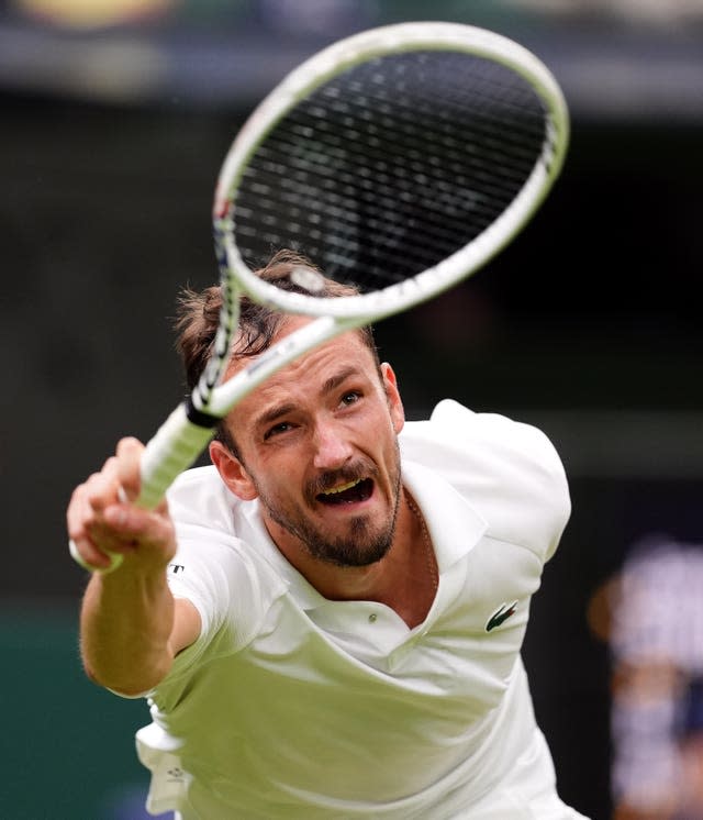 Daniil Medvedev stretches for a forehand