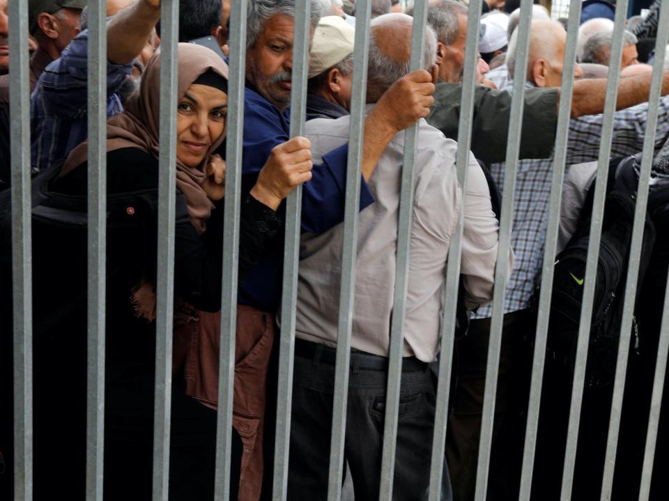 Palestinian workers at Israeli-controlled checkpoint in Jenin, West Bank. May 2019