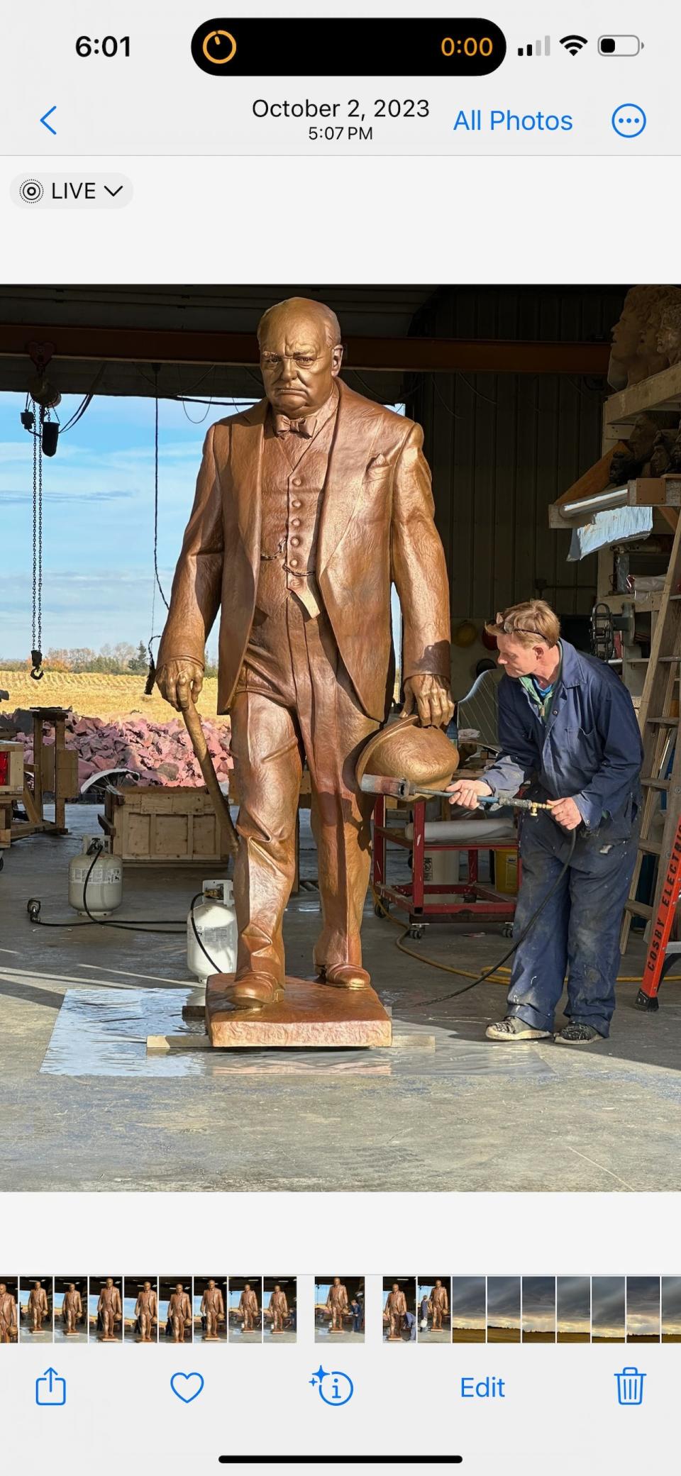 Steve Harman works on the final coats of a bronze Sir Winston Churchill statue at his foundry in Red Deer County.