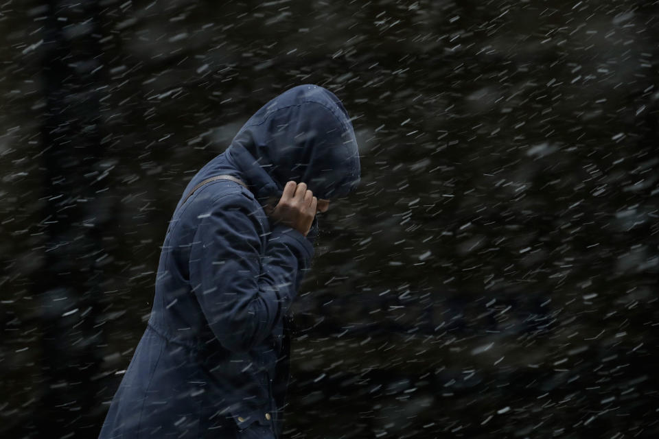 <p>A woman walks through a winter storm, Tuesday, March 20, 2018, in Philadelphia. (Photo: Matt Slocum/AP) </p>