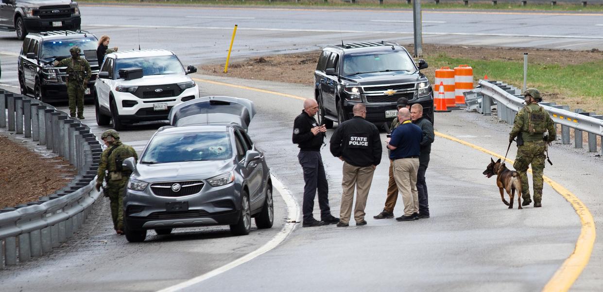 Members of law enforcement investigate a scene where people were injured in a shooting on Interstate 295, in Yarmouth, Maine, Tuesday, April 18, 2023 (AP)