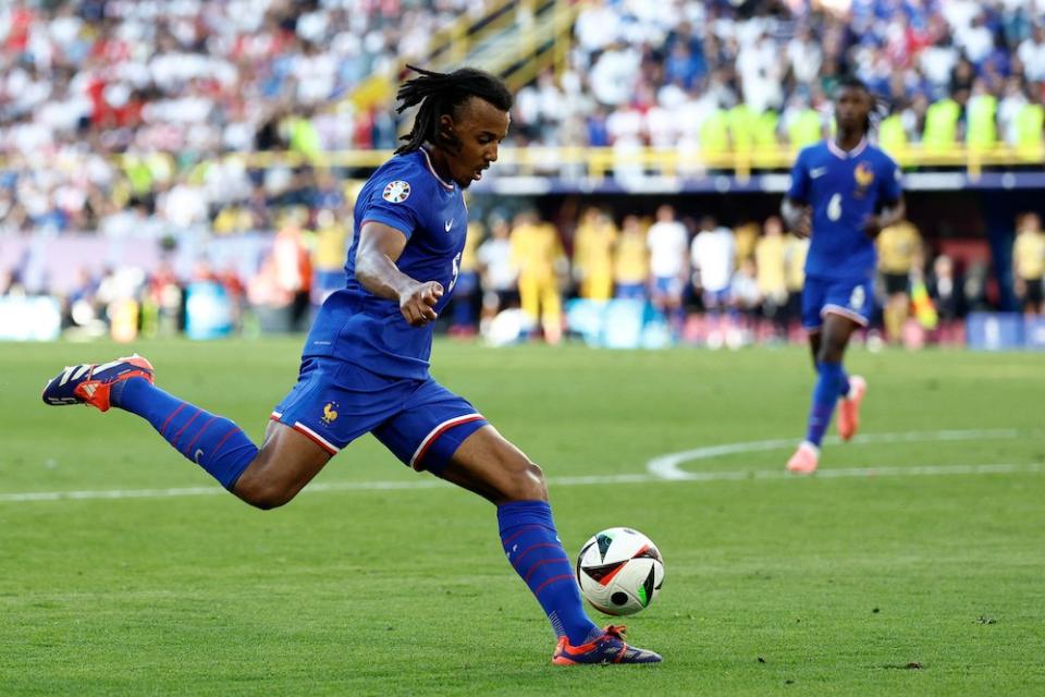 France's Jules Kounde kicks the ball during the UEFA Euro 2024 Group D football match between France and Poland at the BVB Stadion in Dortmund on June 25, 2024. (Photo by KENZO TRIBOUILLARD / AFP)