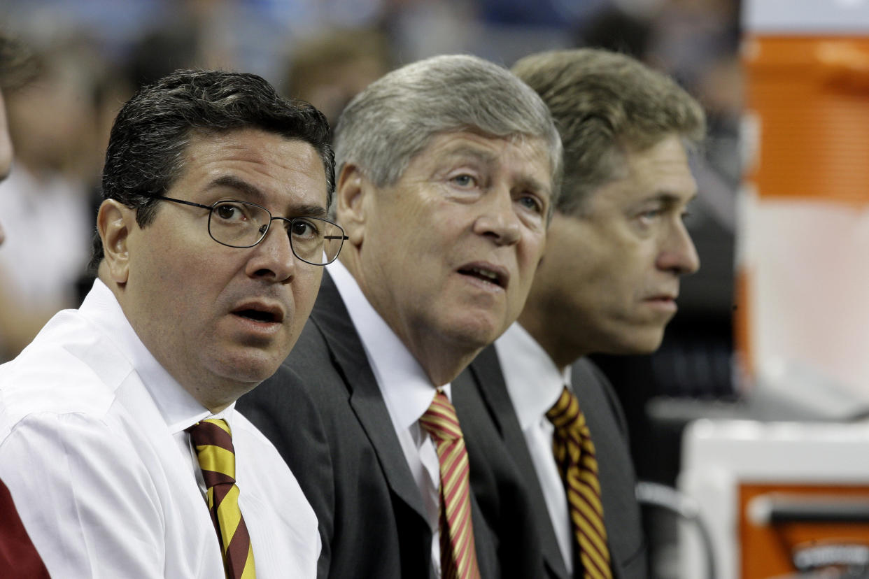 Washington Redskins principal owner Daniel Snyder, from left, and minority owners Dwight Schar and Robert Rothman watch warmups from the bench against the Detroit Lions in an NFL football game in Detroit, Sunday, Sept. 27, 2009. (AP Photo/Paul Sancya )