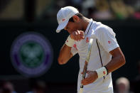 Serbia's Novak Djokovic reacts during his match against Great Britain's Andy Murray on day thirteen of the Wimbledon Championships at The All England Lawn Tennis and Croquet Club, Wimbledon.