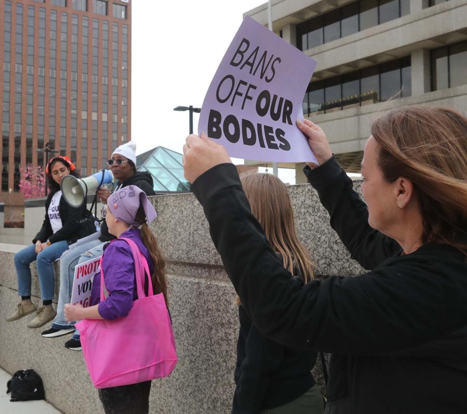Abortion rights supporters participate in a rally in downtown Akron Tuesday evening following the leaked U.S. Supreme Court decision that would reverse Roe V. Wade.