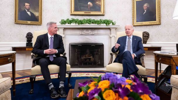 PHOTO: House Speaker Kevin McCarthy listens as President Joe Biden speaks during a meeting on the debt ceiling, in the Oval Office of the White House in Washington, May 22, 2023. (Saul Loeb/AFP via Getty Images)