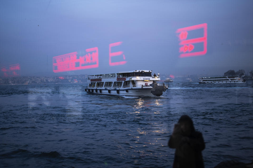 A ferry arrives to Karakoy port terminal after crossing the Bosphorus on a rainy day in Istanbul, Turkey, Wednesday, Feb. 28, 2024. (AP Photo/Francisco Seco)