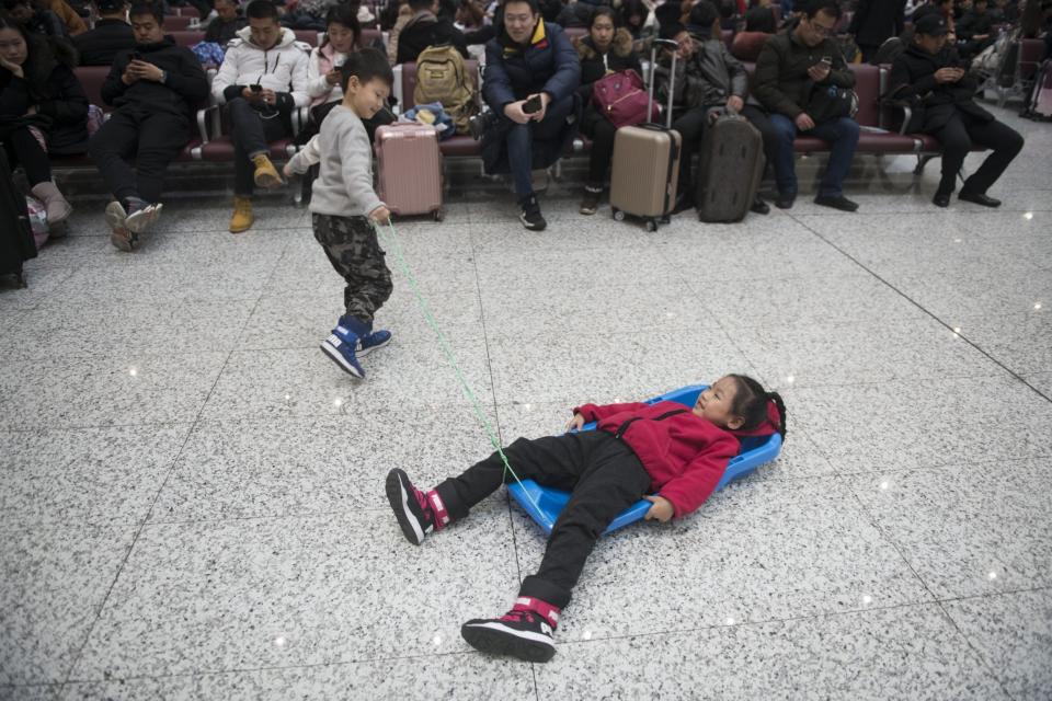 Passengers wait at Harbin Railway Station on January 21 (Getty Images)