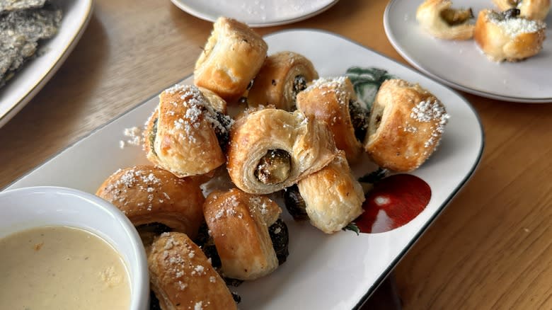 pastry-wrapped sprouts with dipping sauce