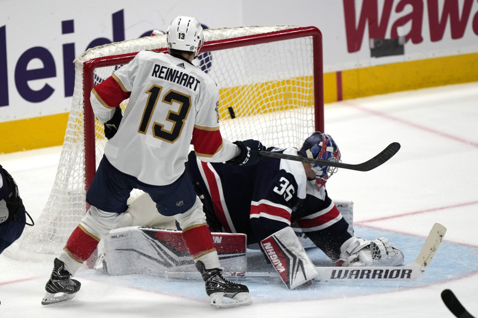 Florida Panthers center Sam Reinhart (13) scores the winning goal past Washington Capitals goaltender Darcy Kuemper (35) in the overtime period of an NHL hockey game, Wednesday, Nov. 8, 2023, in Washington. (AP Photo/Mark Schiefelbein)