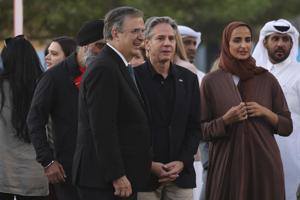 U.S. Secretary of State Anthony Blinken, center, speaks with Mexico's Foreign Affairs Secretary Marcelo Ebrard, center left, and Qatar Foundation CEO Sheikha Hind Bint Al Thani, second right, during a visit to Oxygen Park at Education City, in Doha Qatar, Monday, Nov. 21, 2022. (Karim Jaafar/Pool via AP)