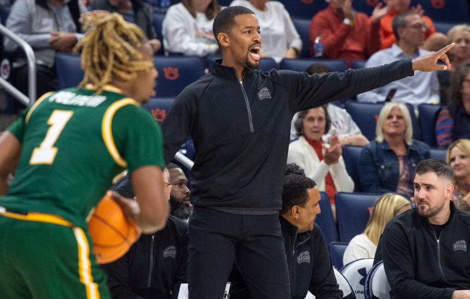 George Mason head coach Kim English talks with his team during a game against Auburn in November.