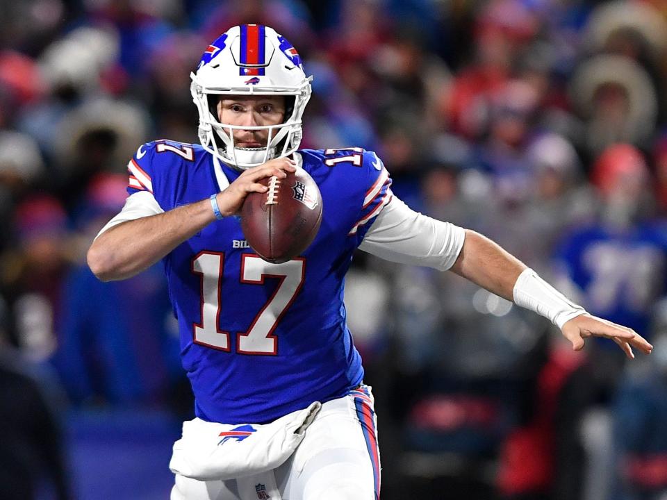 Josh Allen scrambles against the New England Patriots.