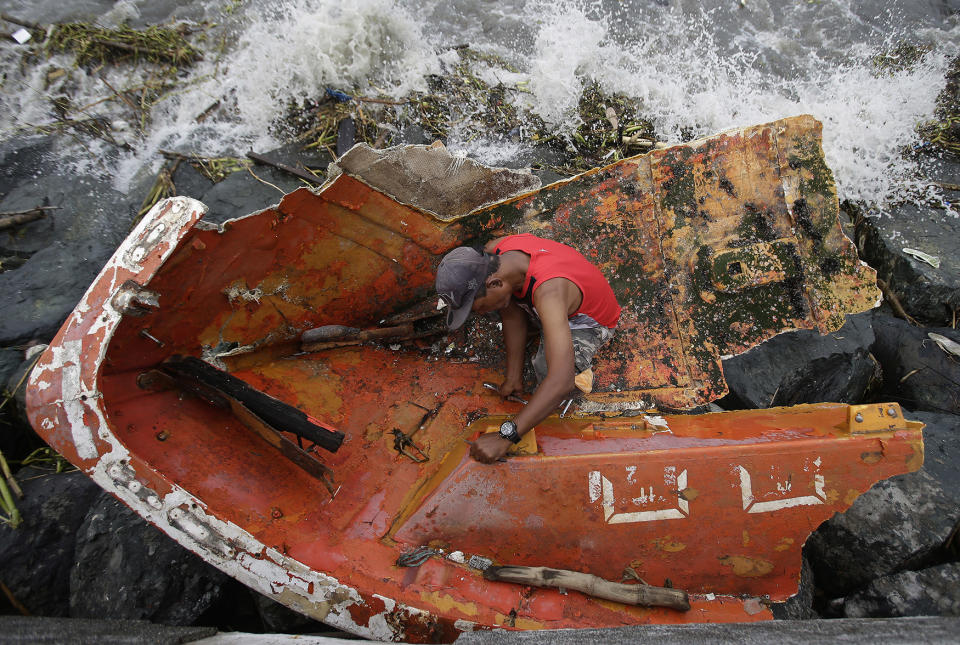 Salvaging wreckage of boat