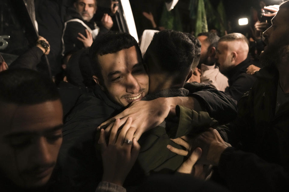 FILE - A man smiles as he is welcomed after being released from prison by Israel, Thursday, Nov. 30, 2023, in the West Bank town of Ramallah. The release of Palestinian prisoners under the Israel-Hamas cease-fire agreement last week has touched nearly everyone in the occupied West Bank, where 750,000 Palestinians have been arrested since 1967. In negotiations with Israel to free hostages in Hamas captivity in Gaza, the militant group has pushed for the release of high-profile prisoners. But experts say most Palestinians passing through Israel’s ever-revolving prison door are young men arrested in the middle of the night for throwing stones and firebombs in villages near Israeli settlements. (AP Photo/Nasser Nasser, File)