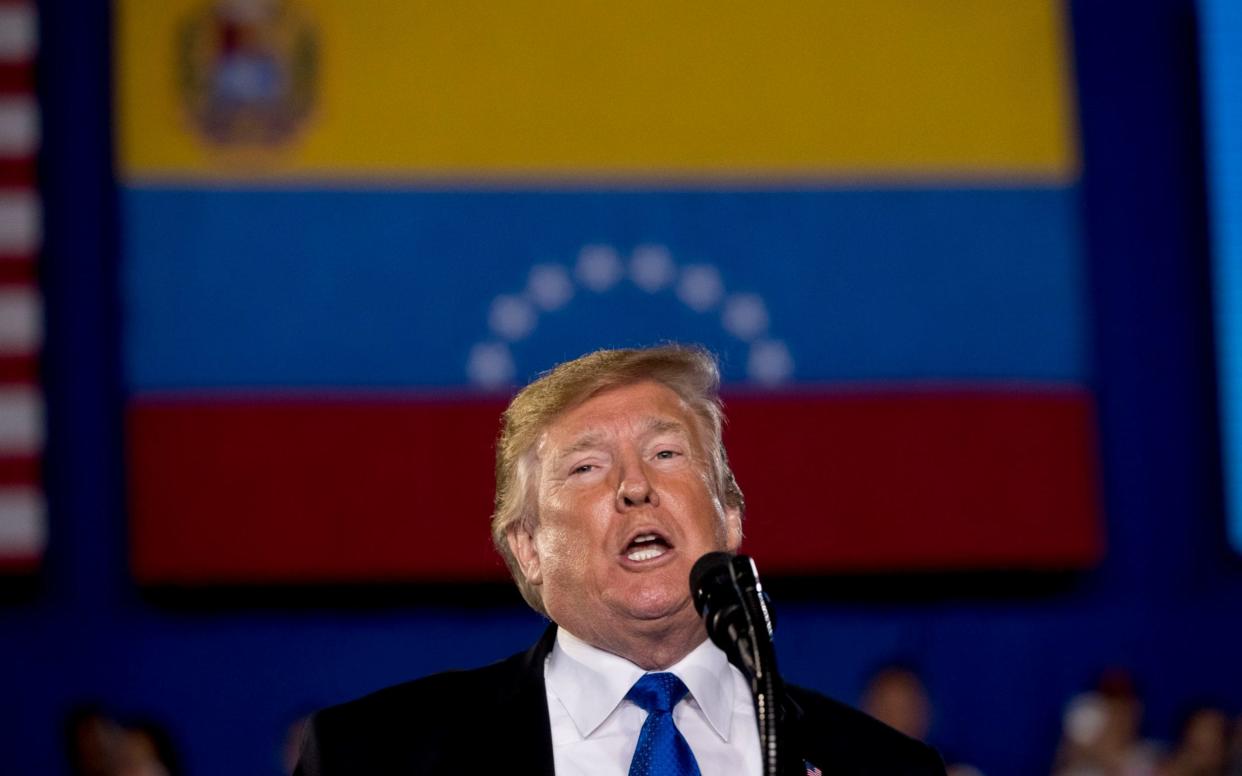 Donald Trump speaks at a gathering of Venezuelan exiles in Miami on Monday - AP