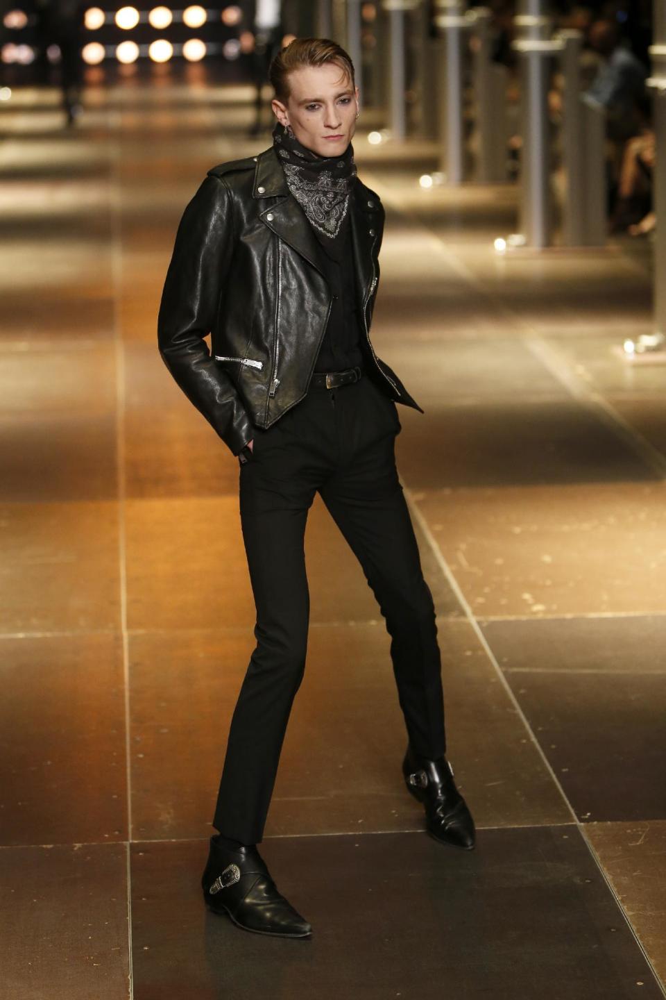 A model presents a creation as part of Yves Saint Laurent's men's fashion Spring-Summer 2014 collection, presented Sunday, June 30, 2013 in Paris. (AP Photo/Francois Mori)