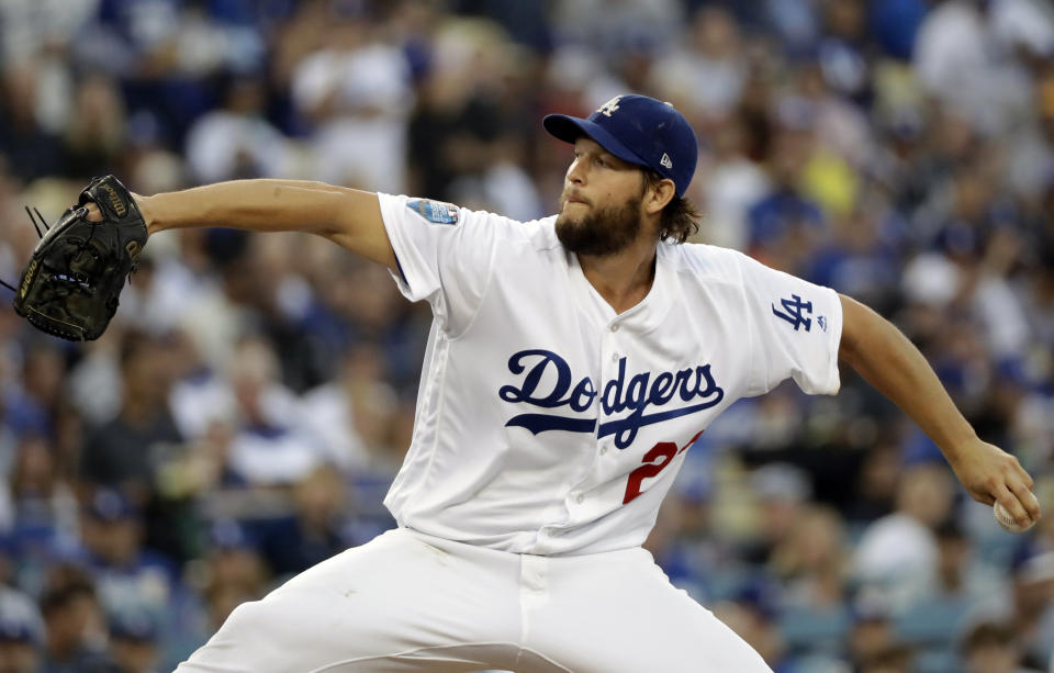 FILE - In this Oct. 28, 2018, file photo, Los Angeles Dodgers pitcher Clayton Kershaw winds up to throw during the first inning in Game 5 of the World Series baseball game against the Boston Red Sox in Los Angeles. Dodgers manager Dave Roberts says Kershaw is making steady progress in his recovery from left shoulder inflammation, but the ace may not be ready to start opening day. (AP Photo/David J. Phillip, File)