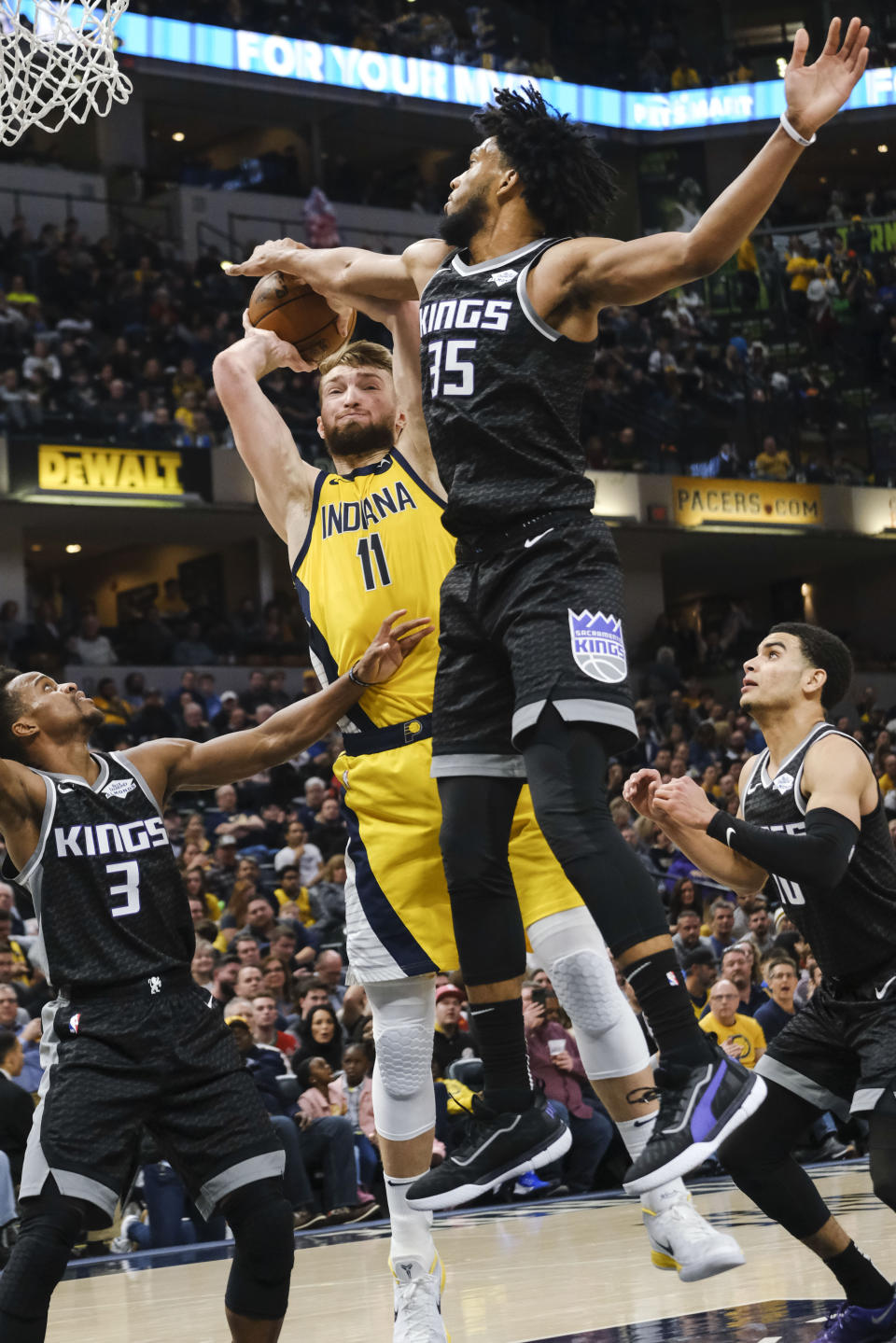 Indiana Pacers forward Domantas Sabonis (11) has his shot blocked by Sacramento Kings forward Marvin Bagley III (35) during the second half of an NBA basketball game in Indianapolis, Friday, Dec. 20, 2019. The Pacers won 119-105. (AP Photo/AJ Mast)