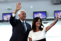 Vice President Mike Pence and his wife Karen wave following a tour on the USNS Comfort, Tuesday, June 18, 2019, in Miami. The hospital ship is scheduled to embark on a five-month medical assistance mission to Latin America and the Caribbean, including several countries struggling to absorb migrants from crisis-wracked Venezuela. (AP Photo/Lynne Sladky)