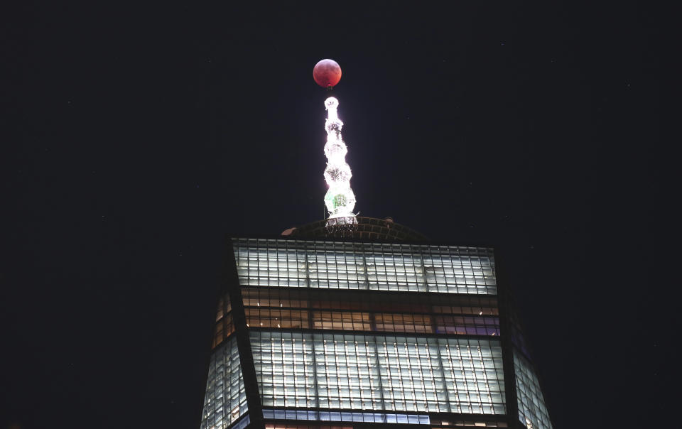 The super wolf blood moon passes over One World Trade Center on Jan. 20 in New York City.