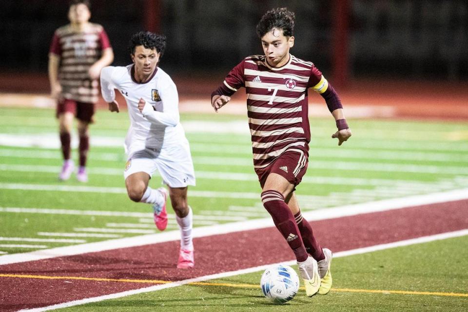 Golden Valley senior Jonathan Gomez Roldan (7) dribbles upfield during a NorCal Regional playoff game against Las Lomas at Golden Valley High School in Merced, Calif., on Tuesday, Feb. 27, 2024. The Knights beat the Cougars 3-1 in penalty kicks.