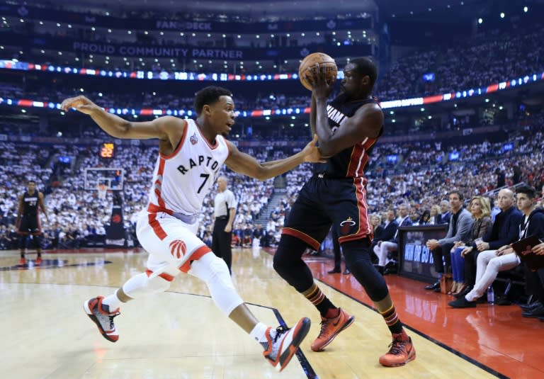 The Miami Heat defeated the Toronto Raptors 102-96 in overtime to claim a 1-0 lead