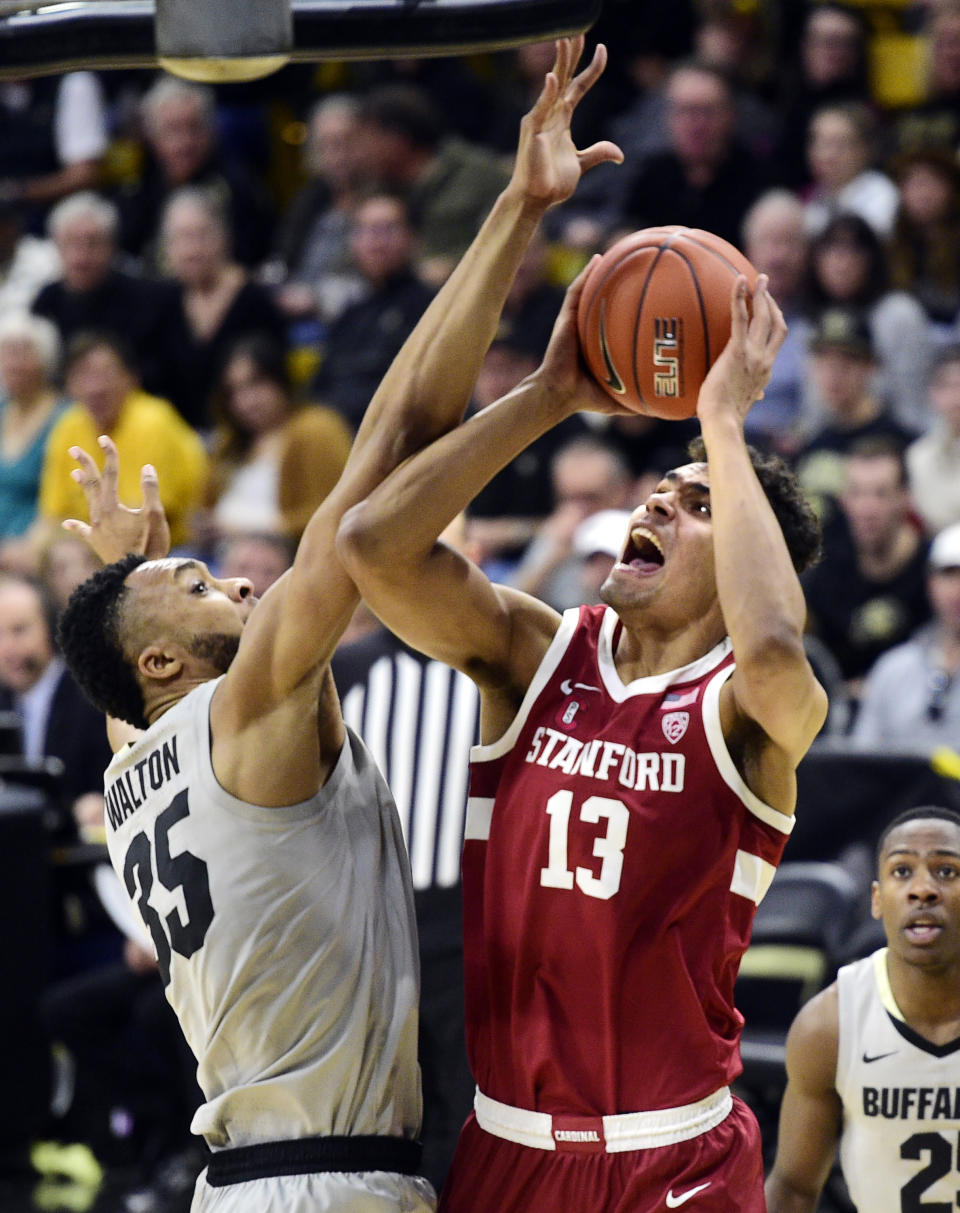 Stanford's Oscar Da Silva goes to the basket as Colorado's Dallas Walton defends during the first half of an NCAA college basketball game Saturday, Feb. 8, 2020, in Boulder, Colo. (AP Photo/Cliff Grassmick)