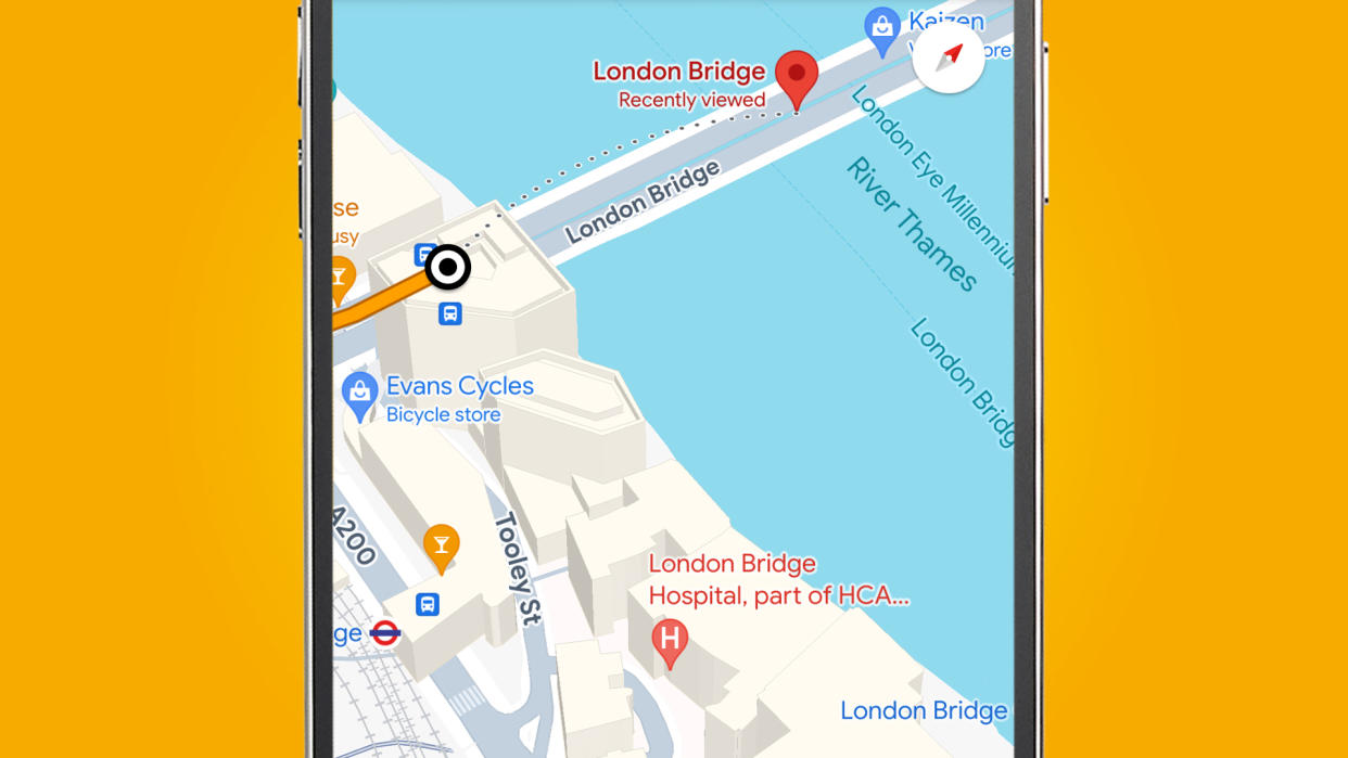  A phone on an orange background showing 3D buildings in the Google Maps app. 