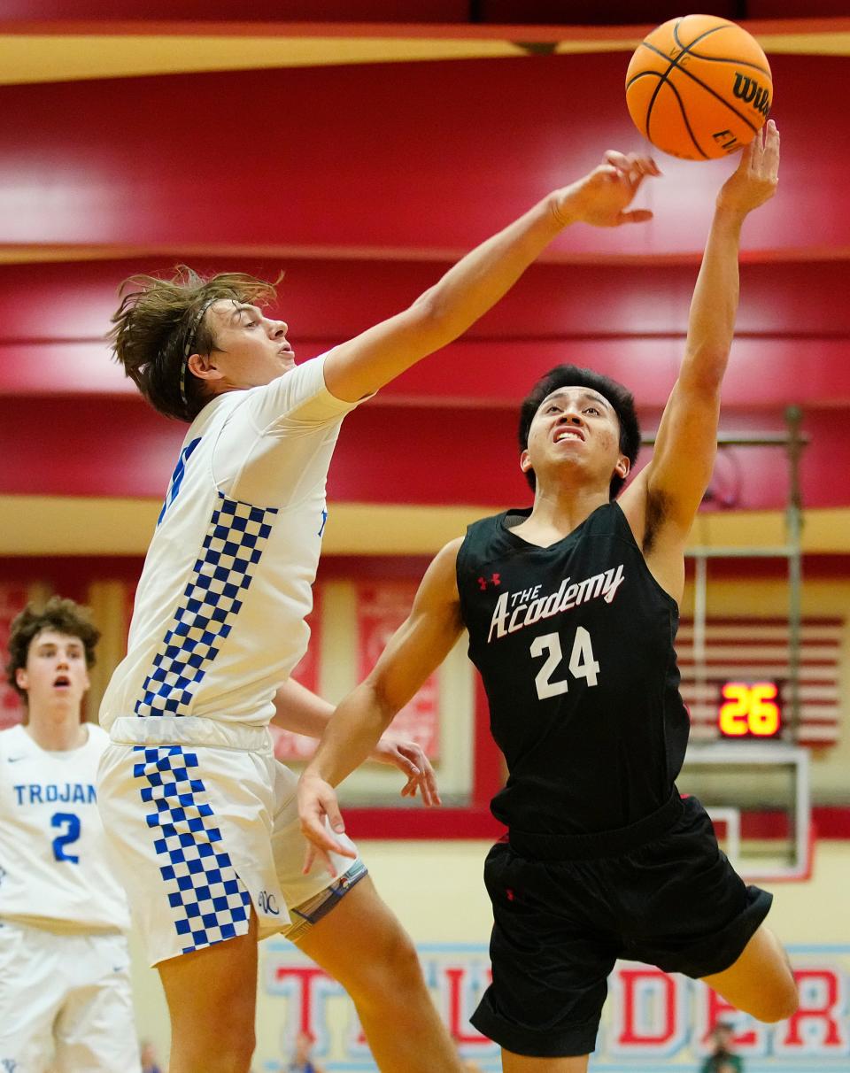 January 13, 2022; Mesa, Ariz; USA; Valley Christian guard Austin Wallace (11) blocks a shot against Scottsdale Christian guard Michael Fan (24) during a game at Mesa Community College. 