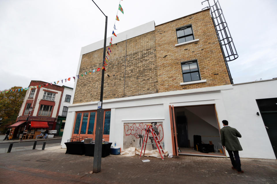 The flats in the development above the Banksy mural are on the market for £1 million (Picture: Reuters)