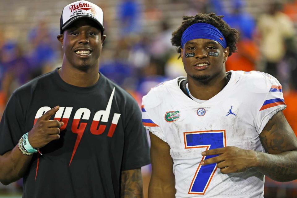 <p>James Gilbert/Getty Images</p> Travis Etienne of the Jacksonville Jaguars (L) poses with his brother Trevor Etienne #7 of the Florida Gators (R) after the Florida Gators spring football game at Ben Hill Griffin Stadium.