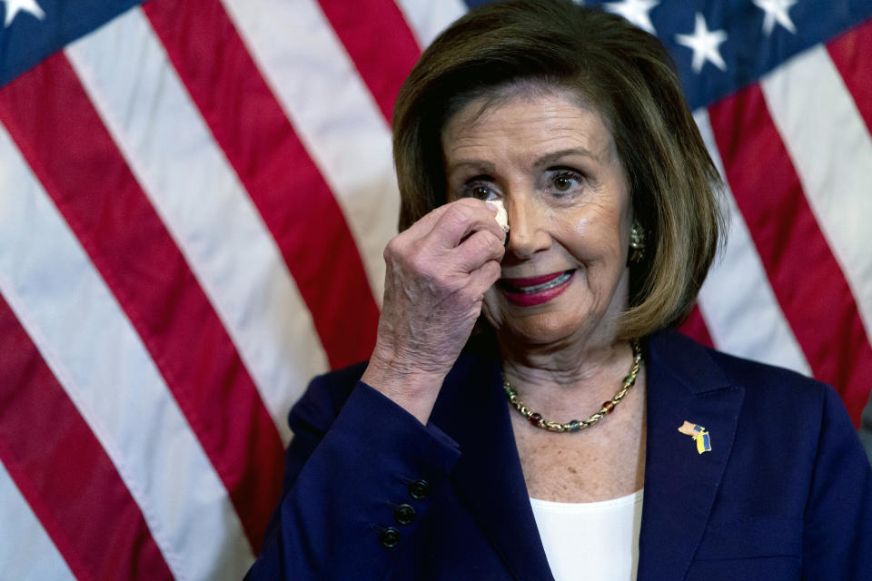 House Speaker Nancy Pelosi of Calif., wipes her eye as she becomes emotional before signing H.R. 8404, the Respect For Marriage Act, during a signing ceremony on Capitol Hill in Washington, Thursday, Dec. 8, 2022. (AP Photo/Andrew Harnik)