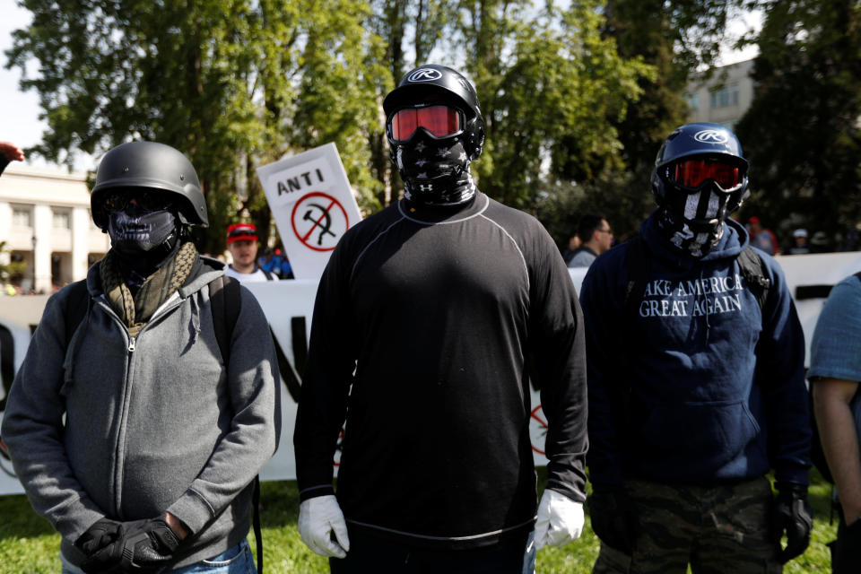 Demonstrators in support of U.S. President Donald Trump rally in Berkeley, California in Berkeley, California, U.S., April 15, 2017. REUTERS/Stephen Lam