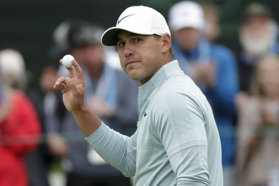 Brooks Koepka waves after his putt on the 15th hole during the final round of the U.S. Open Championship golf tournament Sunday, June 16, 2019, in Pebble Beach, Calif. (AP Photo/Matt York)