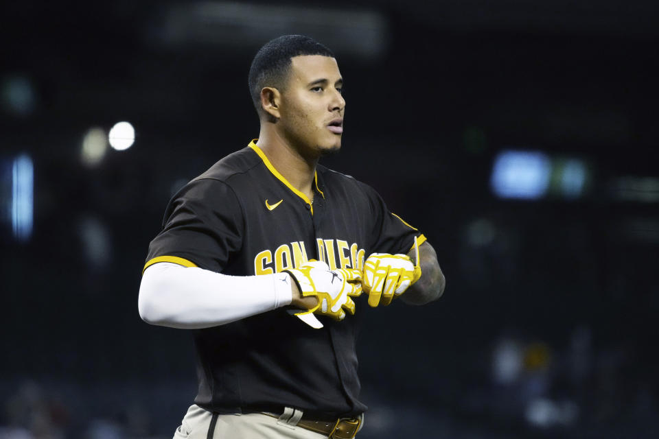 San Diego Padres' Manny Machado reacts after striking out against the Arizona Diamondbacks in the first inning during a baseball game, Tuesday, Aug. 31, 2021, in Phoenix. (AP Photo/Rick Scuteri)