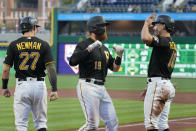 Pittsburgh Pirates' Colin Moran (19) is greeted by Bryan Reynolds (10) and Kevin Newman after hitting a three-run home run off Chicago Cubs starting pitcher Alec Mills in the first inning of a baseball game in Pittsburgh, Tuesday, Sept. 28, 2021. (AP Photo/Gene J. Puskar)